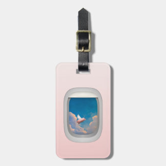 flying pig through airplane window luggage tags