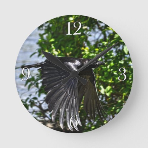 Flying Raven in Sunlight Wildlife Photo Round Clock