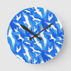 Flying seagulls on sky blue round clock