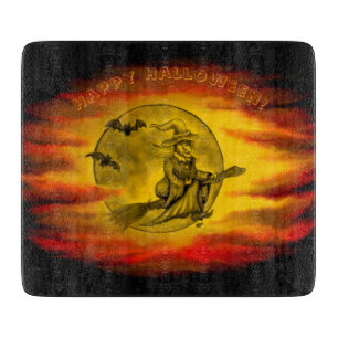 Flying witch with black cat , halloween night cutting board