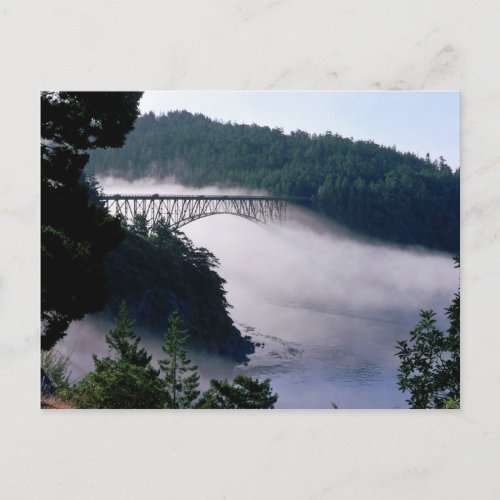 Fog drifts under the Deception Pass bridge at Postcard