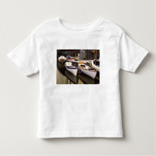 Fog surrounds four boats docked. toddler t-shirt