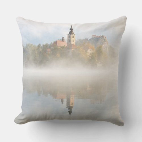 Foggy sunrise at Lake Bled Throw Pillow