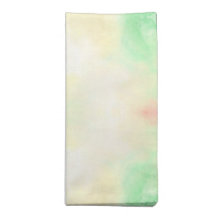 Folded cloth napkin with a soft pastel tie-dye