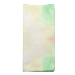 Folded cloth napkin with a soft pastel tie-dye 