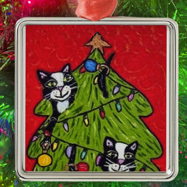 Folk Art Cats Christmas Tree Metal Ornament (Two naughty cat in decorated Christmas tree on red hanging ornament.)