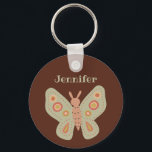 Folk Art Moth, Butterfly on Brown Personalized Keychain<br><div class="desc">Create a small personalized gift or party favor when you add a name to this keychain. It features a folk art style moth illustration against a warm,  brown background with a name above in yellow-green lettering.</div>