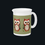 Folk Art Patchwork Owl Cottagecore Woodland Beverage Pitcher<br><div class="desc">This charming folk art owl blends rustic whimsy with cozy cottagecore charm, featuring a beautifully stitched patchwork design inspired by nature and vintage quilting. The warm red, green, and cream tones, combined with delicate floral patterns, evoke the comforting feel of a handcrafted heirloom, perfect for lovers of woodland animals and...</div>