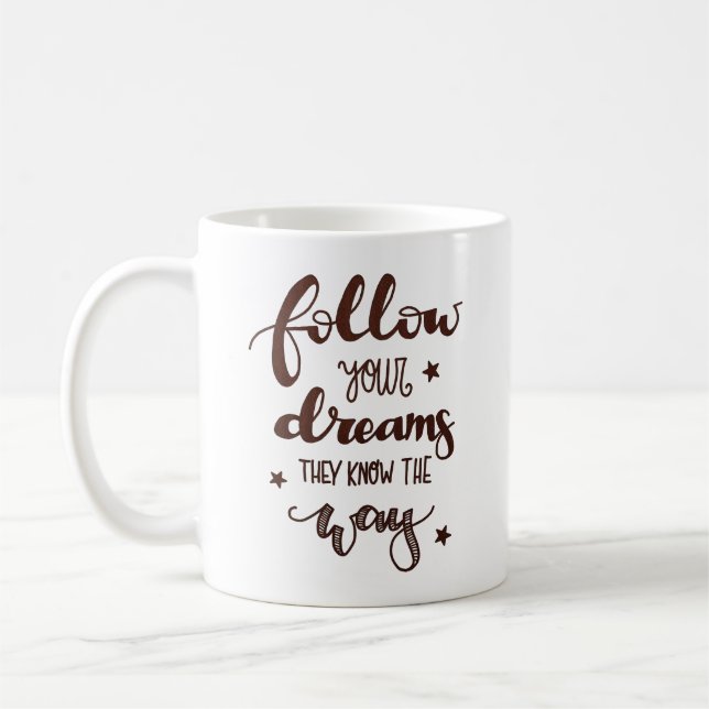 FOLLOW YOUR DREAMS THEY KNOW THE WAY COFFEE MUG (Left)
