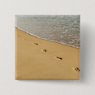Foot prints in Sand with Wave Button