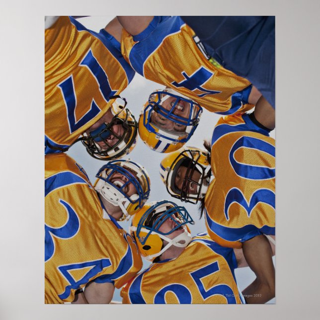 Football players in huddle poster (Front)