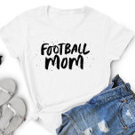 Football team mom stylish black type personalized T-Shirt<br><div class="desc">For the coolest mom at the football field! This fun and trendy type design celebrates the football team mom in you. Makes a great Mother's Day gift or Christmas or birthday gift! And perfect for wearing to games or the carpool! The back includes personalized details that can include a player...</div>