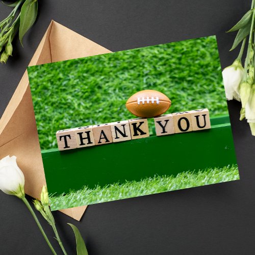 Football Thank you wooden word on green grass Postcard