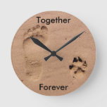 Footprint And Paw Print In Sand Round Clock at Zazzle