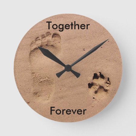 Footprint And Paw Print In Sand Round Clock