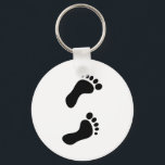 Footprints Keychain<br><div class="desc">Simple solid black graphic of a pair of human foot prints. Customize and choose your own background colour. Image available on various gifts and products.</div>