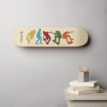 For Skateboarders Skateboarding Graphics Collage Skateboard<br><div class="desc">Surprise your favorite skater with a personalized skate deck. It features silhouette style illustrations of skateboarders in mustard yellow,  turquoise blue,  dark red,  green and rust orange set against a faux woodgrain background and is ready to be personalized with a name in charcoal gray colored letters.</div>