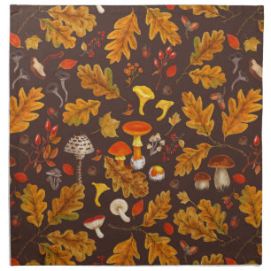 Forest mushrooms and autumn flora on brown cloth napkin