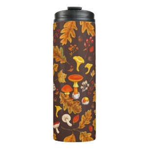 Forest mushrooms and autumn flora on brown thermal tumbler