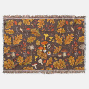 Forest mushrooms and autumn flora on brown throw blanket