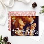 Forever Merry Rose Gold Wedding Photo Holiday Card<br><div class="desc">This elegant holiday greeting card for the new Mr. and Mrs. features a photo from the wedding day with "Forever Merry" in modern brushed script and white custom text that can be personalized with a Merry Christmas message. Branches and berries foliage accents the design and a modern typography pattern of...</div>