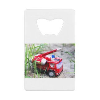 Forgotten toy credit card bottle opener