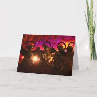Four angels for a bright light and red background holiday card