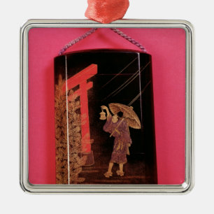 Four case inro depicting a man sheltering metal ornament