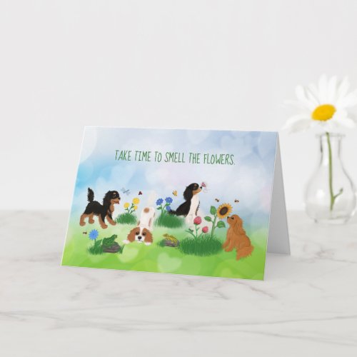 Four Cavalier Spaniels in a Field of Flowers Card