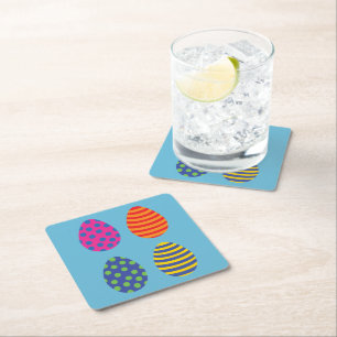 Four colored easter eggs square paper coaster