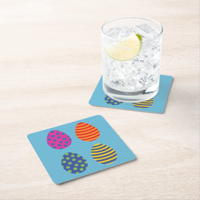 Four colored easter eggs square paper coaster (Insitu)