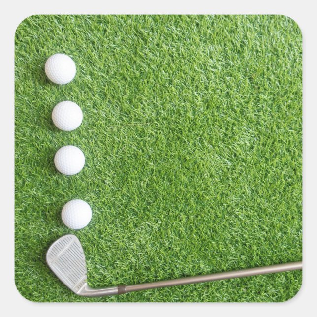 Four golf balls are on green grass with sand wedge square sticker (Front)