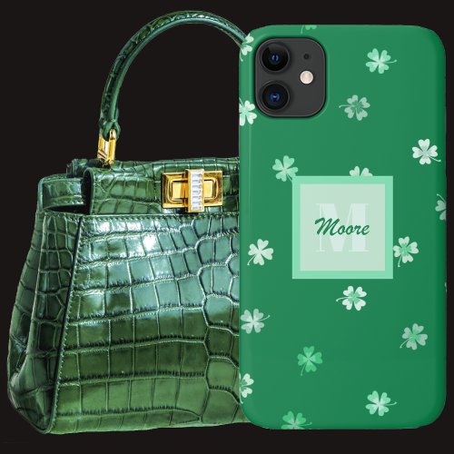 Four Leaf Clovers scattered on a dark green iPhone 11 Case