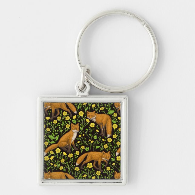 Foxes and buttercups on black keychain (Front)