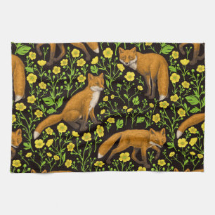 Foxes and buttercups on black kitchen towel