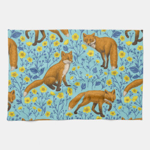 Foxes and buttercups on pool blue kitchen towel
