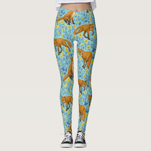 Foxes and buttercups on pool blue leggings (Front)