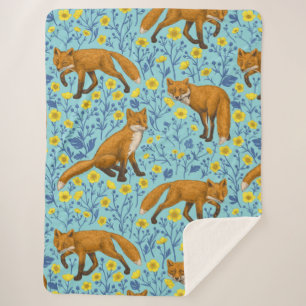 Foxes and buttercups on pool blue sherpa blanket