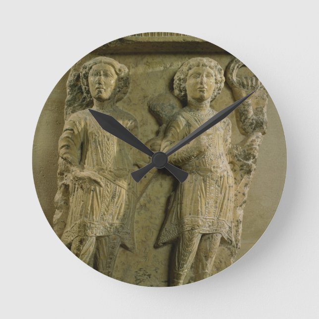 Fragment of a bas-relief plaque depicting two sold round clock (Front)