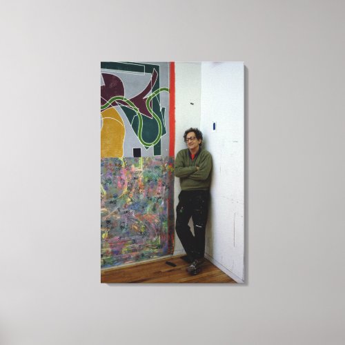 Frank Stella  beside one of his works Canvas Print