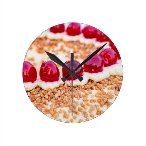 Frankfurt crown cake with cherries on rustic wood round wall clock