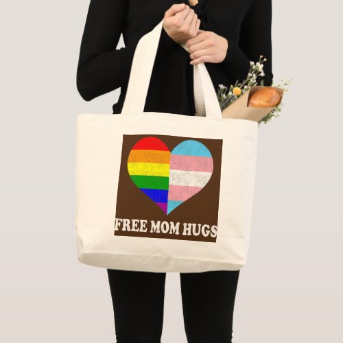 Free mom hugs with rainbow and transgender flag large tote bag