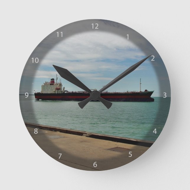 Freighter ship sailing on sea round clock (Front)