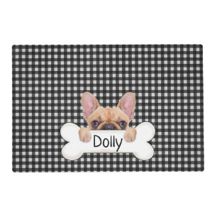 French bulldog with bone and gingham placemat