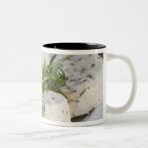 French goat cheese - chevre - with herbs on a Two-Tone coffee mug
