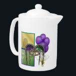 French Quarter Teapot<br><div class="desc">Reminiscent of scenes from the French Quarter in New Orleans, here is a medium white Porcelain teapot with an image, on both sides, of purple balloons, a gold star balloon weight, green and gold squares, a gorgeous green and purple sequin mask, and a silhouettes of female dancer. See matching candy...</div>