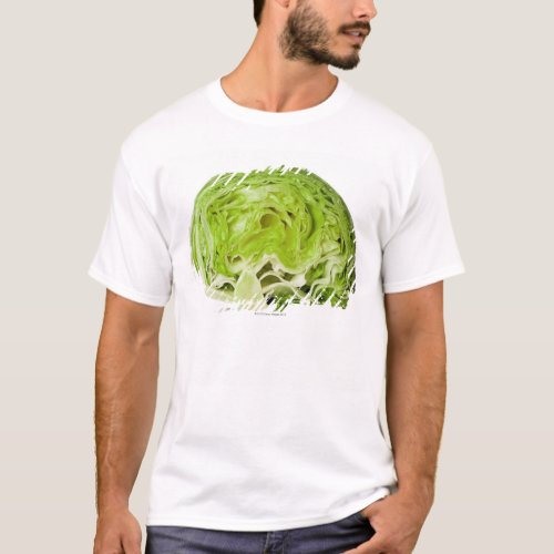 Fresh iceberg lettuce cut in half on white T_Shirt