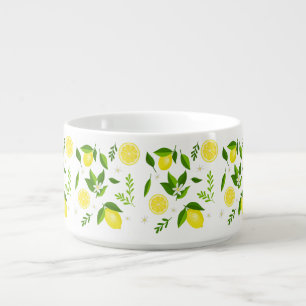 Fresh lemons with flowers and leaves bowl