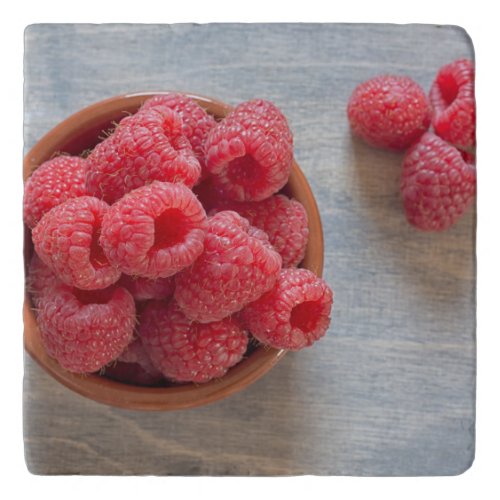 Fresh raspberries in a bowl trivet