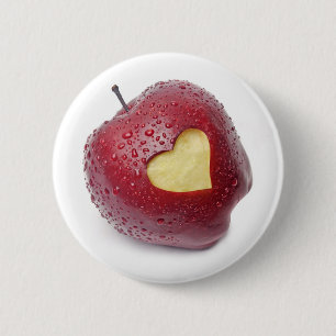 Fresh red apple with a heart shaped symbol pinback button